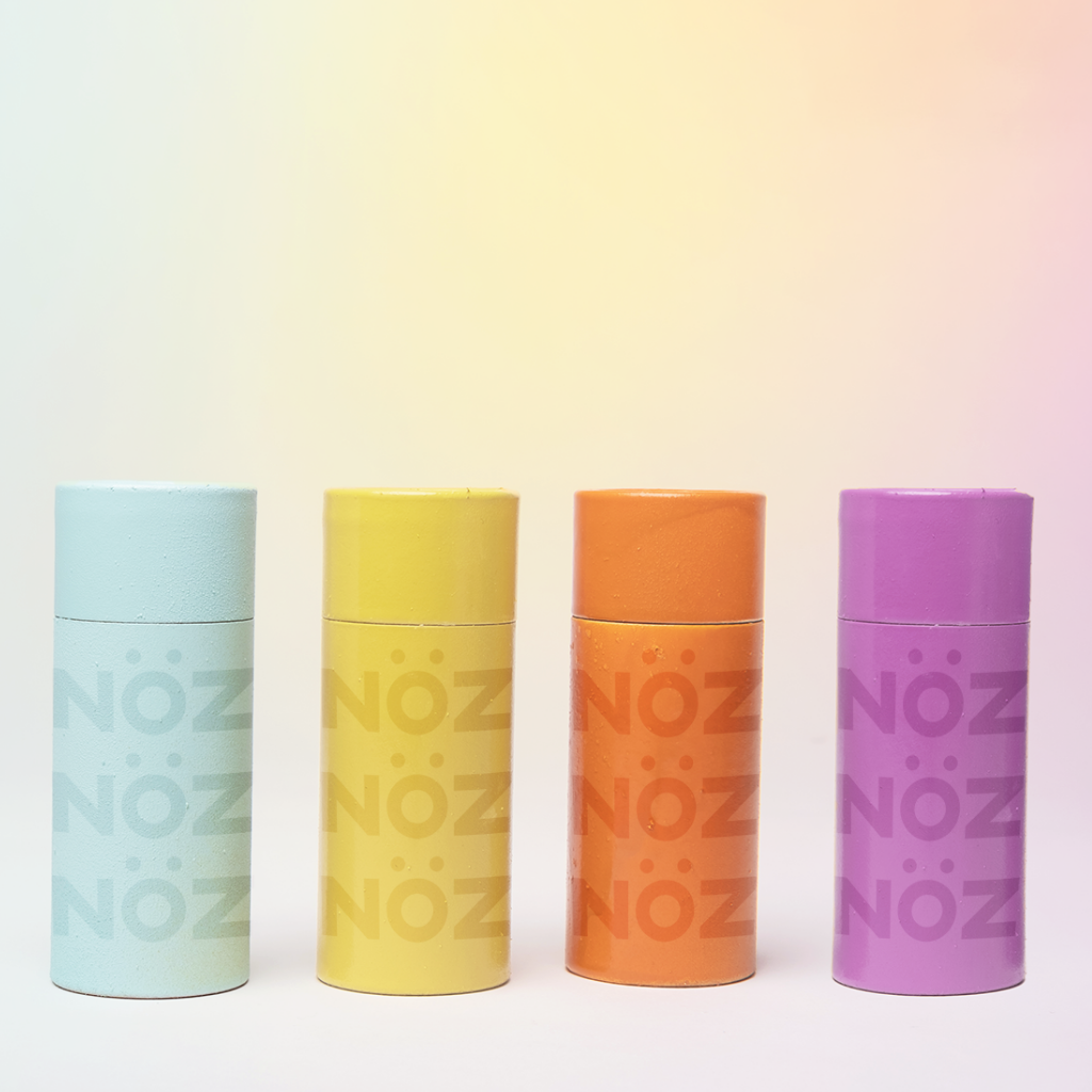 Nöz Sunscreen for face bottles, blue, yellow, orange, and purple